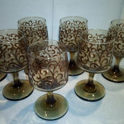Amber colored with raised embossed pattern. Chip free. Perfect for Thanksgiving decor. Either juice/Mimosas/or your favorite wine.