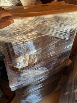 Like new four drawer cabnet wrapped in plastic for protection