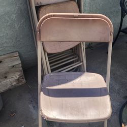 9 plastic folding chairs and 2 metal chairs