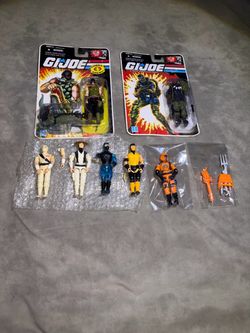 Vintage GI Joe and Mortal Kombat action figures.