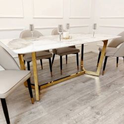Beautiful dining set with gold accents. Table with 4 or 6 chairs, ideal for the family. $100 down payment. Inquire for total price.