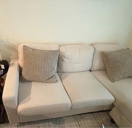 Ivory colored small sectional couch