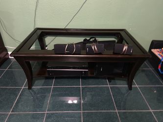 Surround system receiver ,sub and speakers . Coffee table missing glass