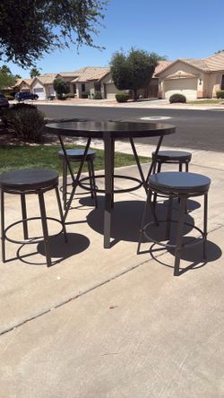 Black Hardwood table with 4 spin chairs