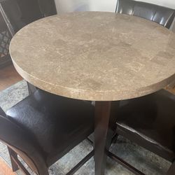 Marble Too Table And Four Leather Chairs 