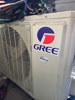 Gree split AC unit with 2 ceiling mount condensing units
