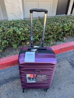 Plum Purple Delsey Hardside Medium Check-In Expandable Spinner Luggage