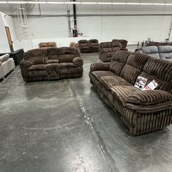 2 pc chocolate wide welt corduroy sofa with drop down tray and love seat with cup console with recliners on the end 