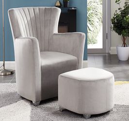 Light grey velvet accent chair with ottoman