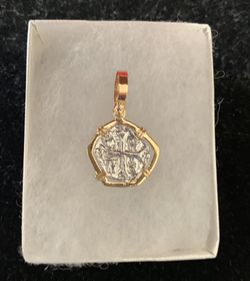 Atocha silver coin pendant in gold bezel