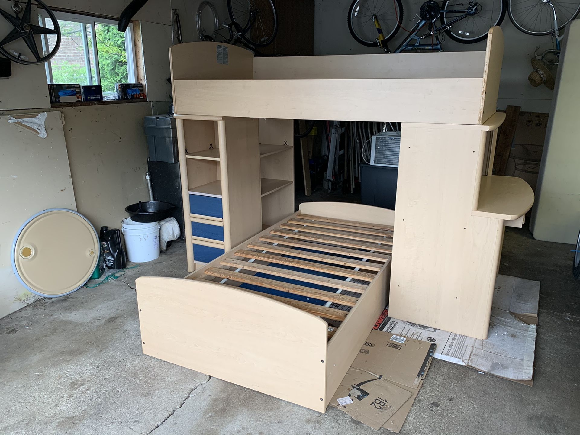 Bunk beds with desk and storage space