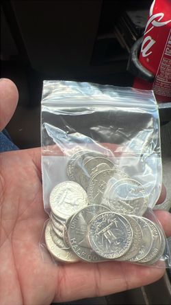 Silver coins and five ounce bar