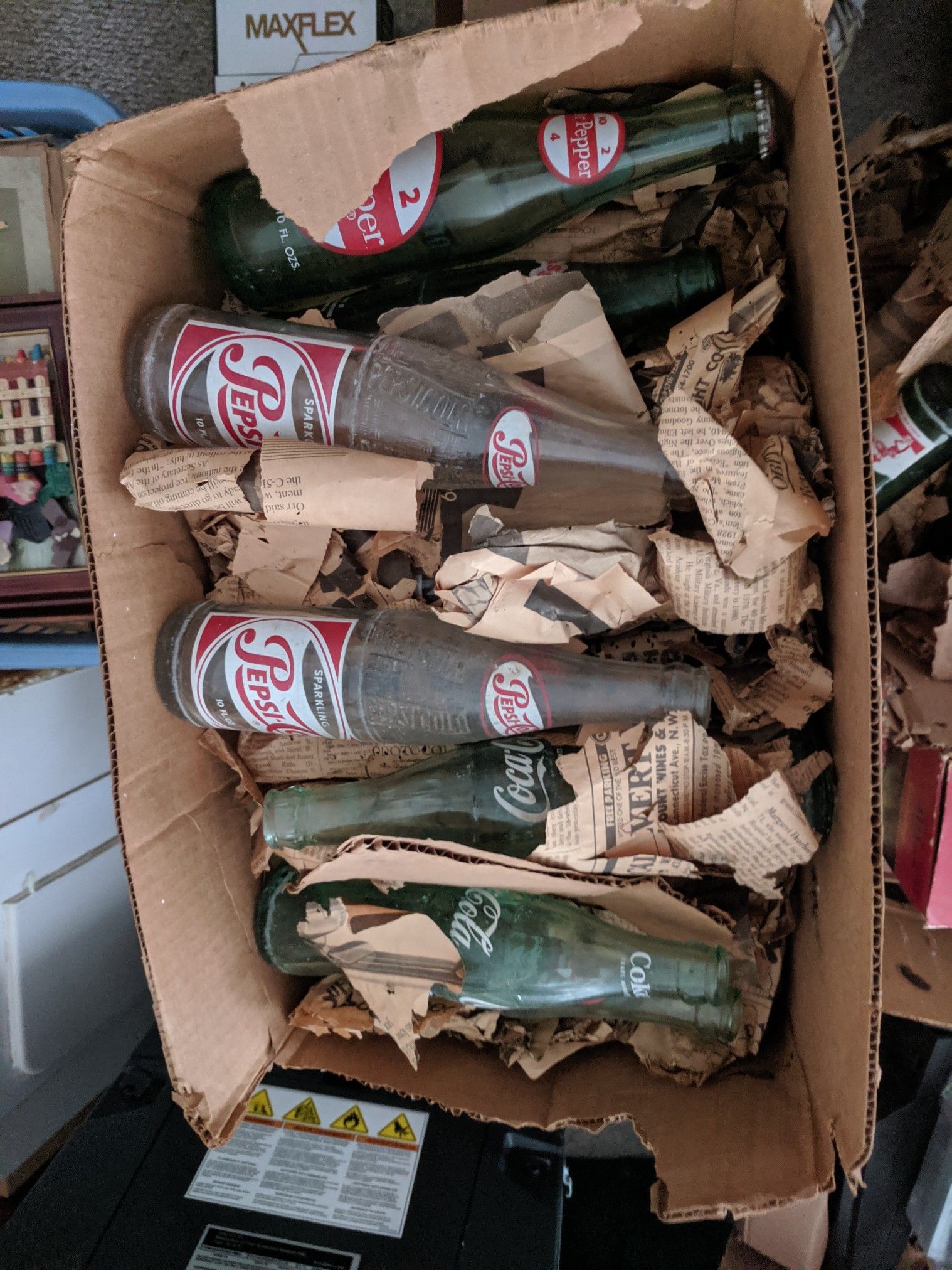 7 boxes looks like 200 antique coke, pepsi, 7-up and other glass bottles. Best offer takes them.