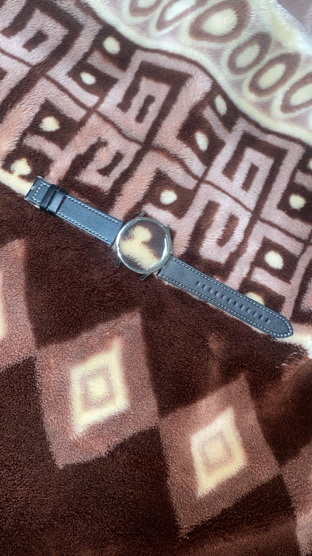  Shinola The Mechanic 39mm watch with a dark olive leather strap. 