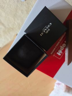 Coach watch box with cushion