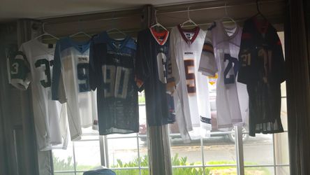 7 NFL and college football jerseys.