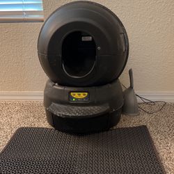 Working condition litter robot with two packs of cat litter