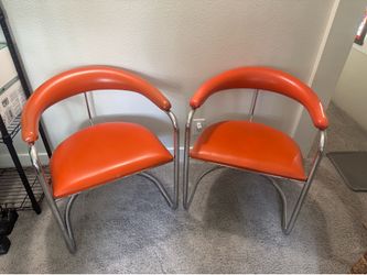 Model SS33 cantilevered armchairs