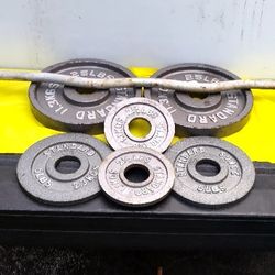 SET OF CAP OLYMPIC PLATES & OLYMPIC  EASY CURL BAR  = (PAIRS OF)  :  25s   5s   2.5s.    




