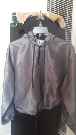 Windbreaker. siverish shiny color, one size fits all made in USA.