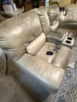 Free dual leather recliner/ loveseat