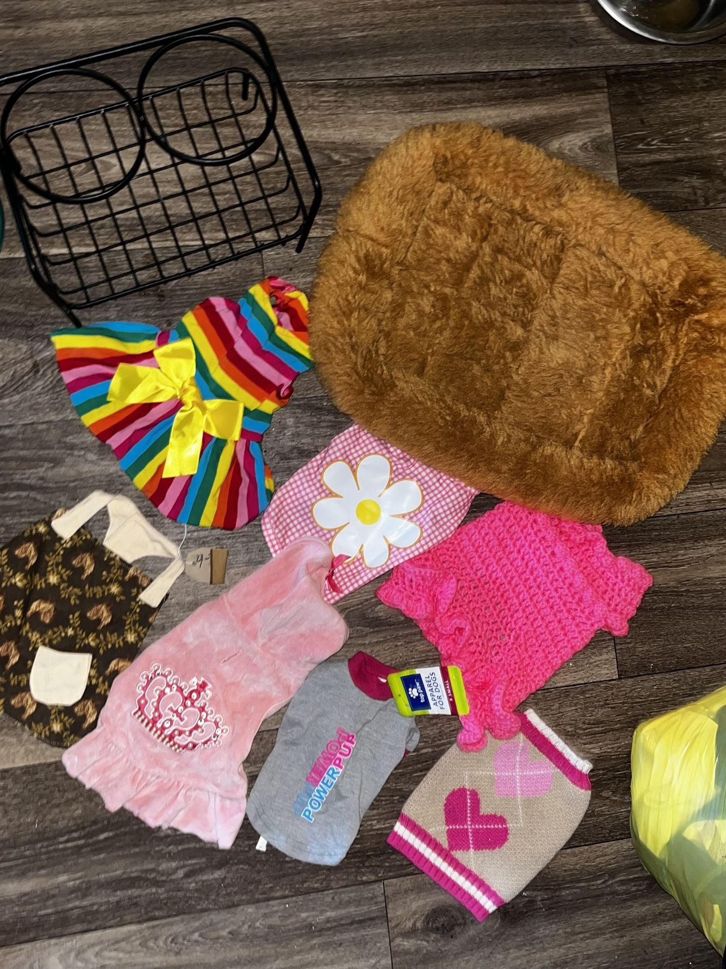 New & Preowned size XS female doggie clothes and a small pet bed and food tray holder. Located off lake mead and Simmons area asking $15 for all