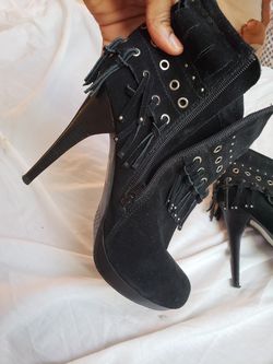 High heel boot with fringe embellisments. Every offer considered. Discount on more than an item