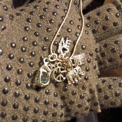 Charm necklace with few charms in perfect condition