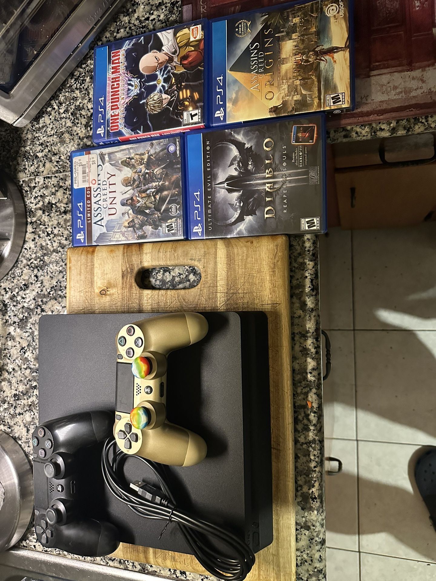 PS4 Bundle (2 Controllers 4 games And Charging Cable)