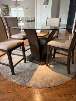 Round glass table with 4 upholstered chairs
