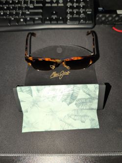 Maui Jim Perico (model 853-10) featuring a tortoise and gold frame with polarized lenses.