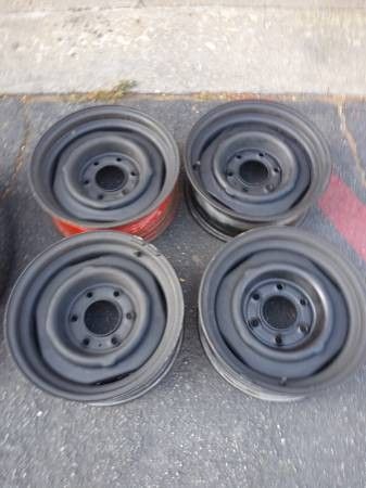 five 15 inch steelies from a Chevy with disk brakes 6 lugs