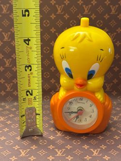 Tweety Bird Figure Alarm Clock Collectible Bird Yellow Orange Plastic   Has a minor broken piece in the back. See photos, tested, works. Batteries not