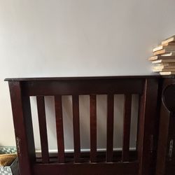 disassembled twin bed with mattress