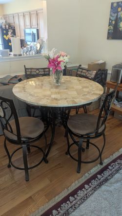 Bar height stone top table and chairs