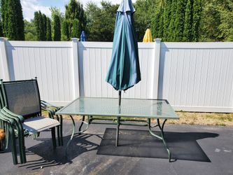 Outdoor table with umbrella and 4 chairs