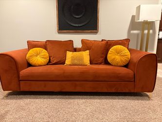 Rust velvet sofa