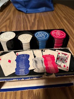 Poker chip set with cards. Red and blue stacks are full. White stack has a few chips missing. Box is used but still works fine.