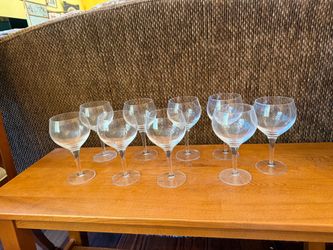 Clear classic long stemmed red wine glasses. Total 9. $10.00 for all.