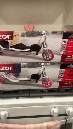 Pink and Red brand new razor scooters.