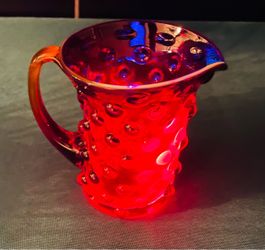 Beautiful vintage Amberina hobnail glass creamer. Amazing glow under UV light