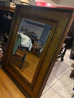 Big Mirror with wood trim is size  58” x 46” n great shape