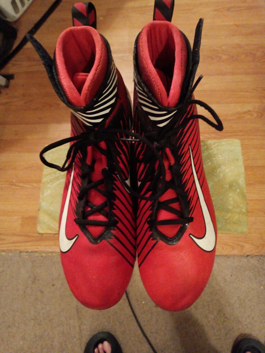 NIKE{strike}red leather lace up high top football cleats