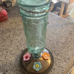 Blue glass hummingbird feeder