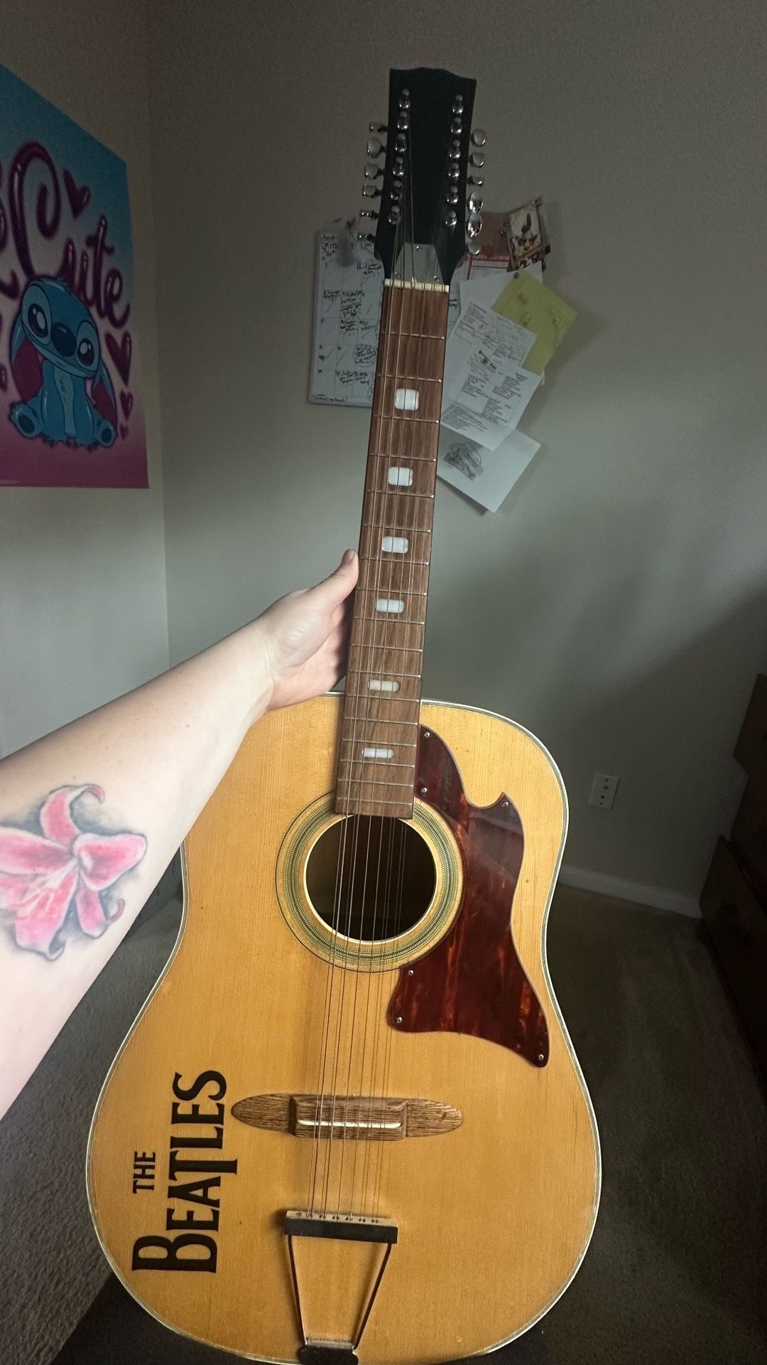 Acoustic guitar with The Beatles Logo