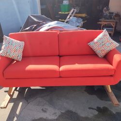 Couch, Red Orange Color,  7 Feet Long, 3 Feet Width, 2 Feet High, 2 Feet Depth 
