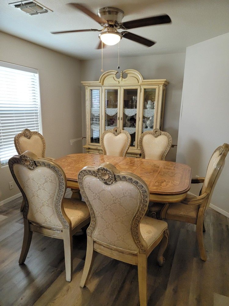 Antique dining room table with 6 chairs and matching hutch/buffet