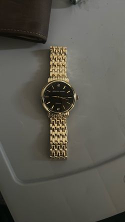 Geoffrey Beene gold stainless steel watch