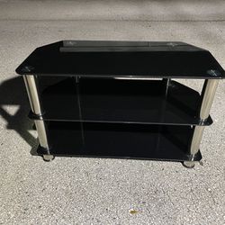 Small TV Stand -( glass top metal, size: 32”x 16”x 20” in high )- Used 
