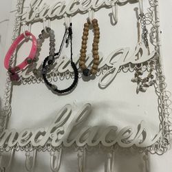 grey small rack with wheels and jewelry hanger